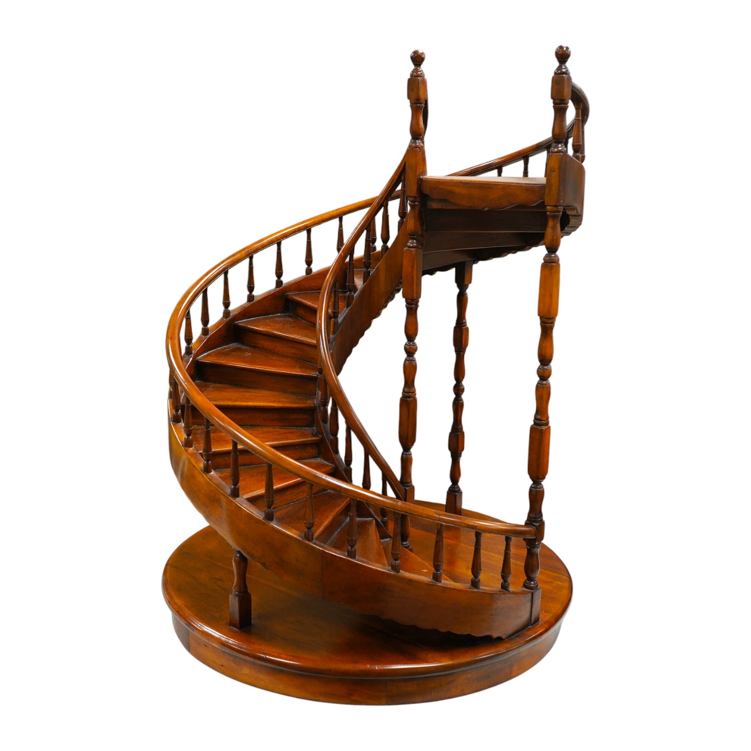 Theodore Alexander, Vietnam, a hardwood model of a spiral staircase, 61cm high, 46cm diameter, maker’s label to base. Condition - good.